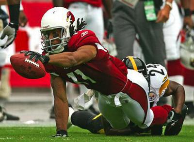 Pitt alum Larry Fitzgerald goes for a first down on the Cardinals, 8/06 via panthersinthepros
